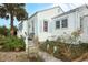 Detailed view of the exterior with light blue trim outlining the windows and siding at 330 Phoenix Ave, Daytona Beach, FL 32118