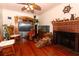 Inviting living room offers a brick fireplace, hardwood floors, and comfortable seating at 330 Phoenix Ave, Daytona Beach, FL 32118