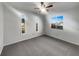 Cozy bedroom with plush carpet, great natural light, and a ceiling fan at 3321 Crimson Ln, Deltona, FL 32738