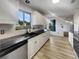 Bright and modern kitchen featuring granite countertops, and updated appliances at 3321 Crimson Ln, Deltona, FL 32738