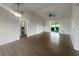 Spacious living room featuring new flooring and sliding glass doors to the backyard at 3321 Crimson Ln, Deltona, FL 32738