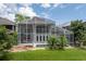 Aerial view of a home's screened pool, patio, and lush backyard at 334 N Shadowbay Blvd, Longwood, FL 32779