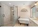 Updated bathroom with a glass-enclosed shower and classic clawfoot tub at 334 N Shadowbay Blvd, Longwood, FL 32779