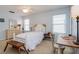 Serene bedroom with a white bed, offering a peaceful retreat with natural light at 334 N Shadowbay Blvd, Longwood, FL 32779