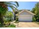 Beautiful two-story home with a two-car garage, lush landscaping, and inviting curb appeal at 334 N Shadowbay Blvd, Longwood, FL 32779
