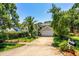 Charming two-story home featuring mature landscaping, a palm tree and an attached two car garage at 334 N Shadowbay Blvd, Longwood, FL 32779