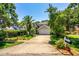 Charming two-story home with a well-manicured lawn, lush trees, and an inviting driveway at 334 N Shadowbay Blvd, Longwood, FL 32779
