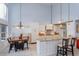 Bright kitchen featuring high ceilings, custom cabinetry, granite counters and a cozy dining area at 334 N Shadowbay Blvd, Longwood, FL 32779