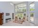 Light-filled living area featuring high ceilings and large windows at 334 N Shadowbay Blvd, Longwood, FL 32779