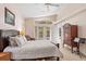 Bright main bedroom featuring a cozy seating area, large windows and a private entrance to the outdoors at 334 N Shadowbay Blvd, Longwood, FL 32779