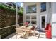 Inviting screened patio featuring a cozy seating area with a lush green backdrop at 334 N Shadowbay Blvd, Longwood, FL 32779