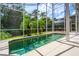 Screened-in pool surrounded by a patio and lush landscaping at 334 N Shadowbay Blvd, Longwood, FL 32779