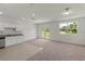 Spacious living room with access to the backyard through french doors and featuring modern finishes at 3435 Vesara Dr, Davenport, FL 33837