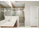 Bright bathroom features double sinks with a glass enclosed shower at 3451 Players Point Loop, Apopka, FL 32712