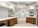 Bathroom featuring double vanity sinks, a soaking tub, and neutral tiling at 3451 Players Point Loop, Apopka, FL 32712