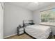 Bedroom features a bed and a window with blinds at 3451 Players Point Loop, Apopka, FL 32712