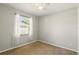 Empty bedroom features a ceiling fan and a window at 3451 Players Point Loop, Apopka, FL 32712