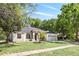 Beautiful single-story home with a well-maintained lawn, arched windows, and a two-car garage at 3451 Players Point Loop, Apopka, FL 32712