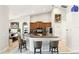 Bright kitchen with stainless steel appliances and a breakfast bar with seating for three at 3451 Players Point Loop, Apopka, FL 32712