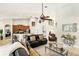 Spacious living room featuring a ceiling fan, leather furniture and an open floor plan at 3451 Players Point Loop, Apopka, FL 32712