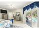 Stylish main bedroom with a view of the backyard pool area at 3451 Players Point Loop, Apopka, FL 32712