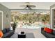 Covered patio with outdoor seating overlooking a screened-in pool area at 3451 Players Point Loop, Apopka, FL 32712