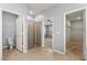 Bathroom showcasing a glass shower, a toilet, and an open doorway to the walk-in closet and bedroom at 3925 Green Sabal Dr, Orlando, FL 32824