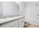 Bright bathroom with double sink vanity, granite countertop, and shower/tub combo at 3925 Green Sabal Dr, Orlando, FL 32824