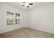 Carpeted bedroom featuring a ceiling fan and a large window with lots of natural light at 3925 Green Sabal Dr, Orlando, FL 32824
