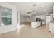 Bright, open kitchen features granite countertops, stainless steel appliances, and tile flooring at 3925 Green Sabal Dr, Orlando, FL 32824