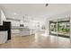 Modern kitchen with an island, stainless appliances, ample counter space and glass doors to the lanai at 3925 Green Sabal Dr, Orlando, FL 32824