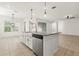 Well-lit kitchen with a stainless steel dishwasher, undermount sink, and a center island at 3925 Green Sabal Dr, Orlando, FL 32824