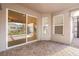 Covered outdoor patio featuring brick flooring and sliding glass doors leading to the interior of the home at 3925 Green Sabal Dr, Orlando, FL 32824