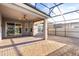 Spacious covered patio featuring brick flooring, a ceiling fan, and an enclosed lanai with screen at 3925 Green Sabal Dr, Orlando, FL 32824