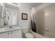 Cozy bathroom featuring a vanity sink, a toilet, and a shower-tub with a stylish shower curtain at 4249 Andover Cay Blvd, Orlando, FL 32825