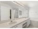 Bright bathroom with double vanity, soaking tub, shower, and ample counter space at 4249 Andover Cay Blvd, Orlando, FL 32825