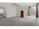 Spacious bonus room featuring soft carpeting, a ceiling fan, and large windows at 4249 Andover Cay Blvd, Orlando, FL 32825