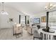 Bright living room featuring neutral decor, tile floors, and plenty of natural light at 4249 Andover Cay Blvd, Orlando, FL 32825