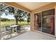 Relaxing screened patio with seating, overlooking a tranquil pond at 4249 Andover Cay Blvd, Orlando, FL 32825