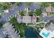 Top-down view of property with parking, pool, and lake at 4704 Walden Cir # 21, Orlando, FL 32811