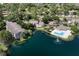 Aerial view showing complex with pool and lake with fountain at 4704 Walden Cir # 21, Orlando, FL 32811