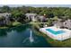 Aerial view of complex showing pool, fountain, and lush landscaping at 4704 Walden Cir # 21, Orlando, FL 32811