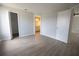 A bedroom with light gray walls, white trim and light-colored wood-look floors has an attached bathroom and closet at 4704 Walden Cir # 21, Orlando, FL 32811