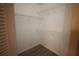 Walk-in closet showing white walls, wood-look floors, and multiple white wire shelves for optimal storage and organization at 4704 Walden Cir # 21, Orlando, FL 32811