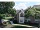 Attractive condo showcasing manicured lawn, mature trees and a classic architectural style at 4704 Walden Cir # 21, Orlando, FL 32811