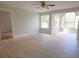 Spacious main bedroom featuring large windows, light gray walls, and wood floors at 4704 Walden Cir # 21, Orlando, FL 32811