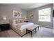 Serene bedroom with a king-sized bed, neutral decor, and ample natural light at 4704 Walden Cir # 21, Orlando, FL 32811