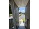 View from top of staircase, with a view of the neighborhood through the breezeway at 4704 Walden Cir # 21, Orlando, FL 32811