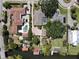 Stunning aerial view of luxury homes with pools, lush landscaping, and waterfront access, showcasing upscale living at 5127 Leeward Way, Orlando, FL 32809