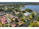 Captivating aerial view of premier lakeside homes, highlighting their private docks, pools, and picturesque landscaping at 5127 Leeward Way, Orlando, FL 32809